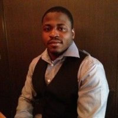 Dontae is wearing a black waistcoat.